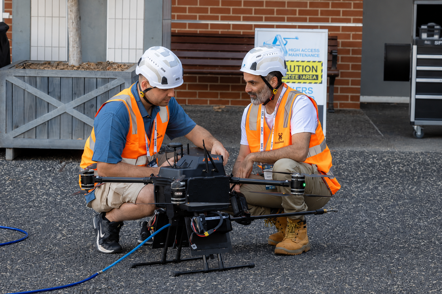 CASA-certified AeroClean operators with drone on the ground